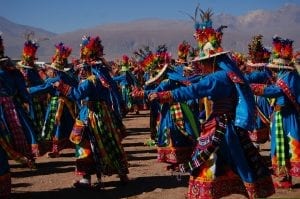 Chileans in traditional dress performing a ritual dance