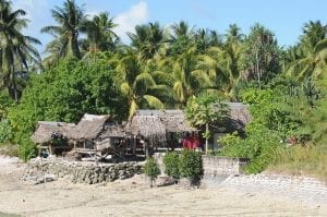 traditional huts on the beach in Kiribati