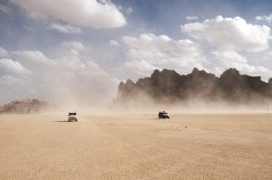 jeeps driving through the sandy deserts of Jordan 
