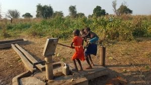 Children at water pump, South Sudan