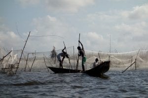 Fishing from small traditional boats in Benin