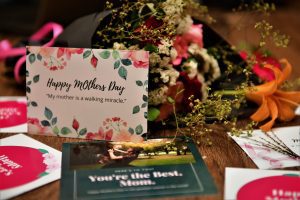 a mother's day card and flowers