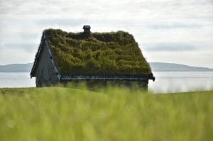 a small crofters house overlooking the sea on the fares islands