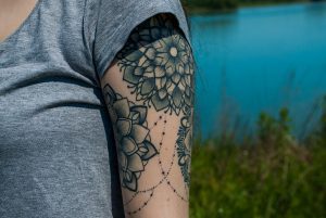 flower tattoo on upper arm