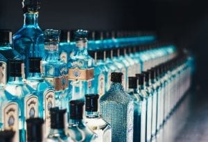 long lines of bottles of gin