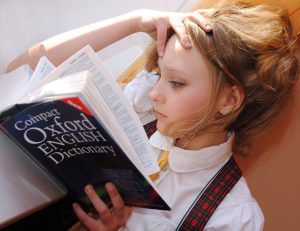 girl reading the dictionary