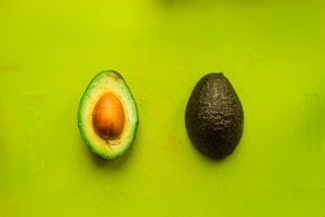 an avocado split in to halves