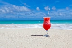 a cold refreshing drink on a beach