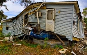 a wooden house that landed on top of a car during a hurricane in New Orleans