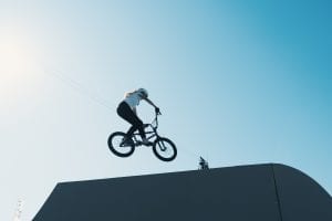 A BMX jumping off a ramp