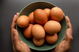 a bowl of fresh brown hens eggs