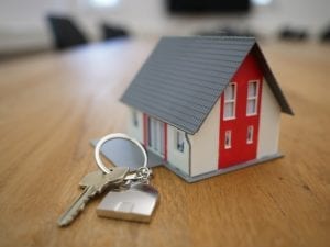 A model of a house and a house key