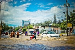 cars driving through flood water