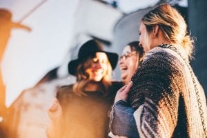 group of women talking and laughing 