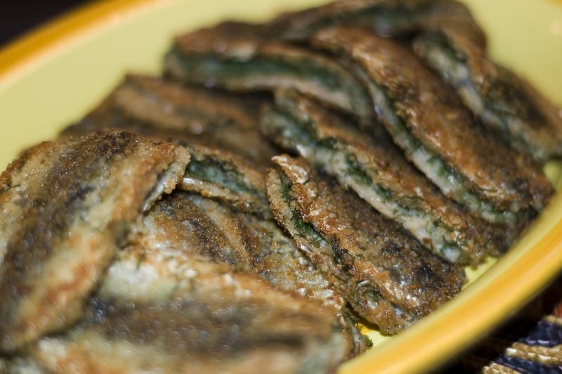 a plate of herring, ready to eat