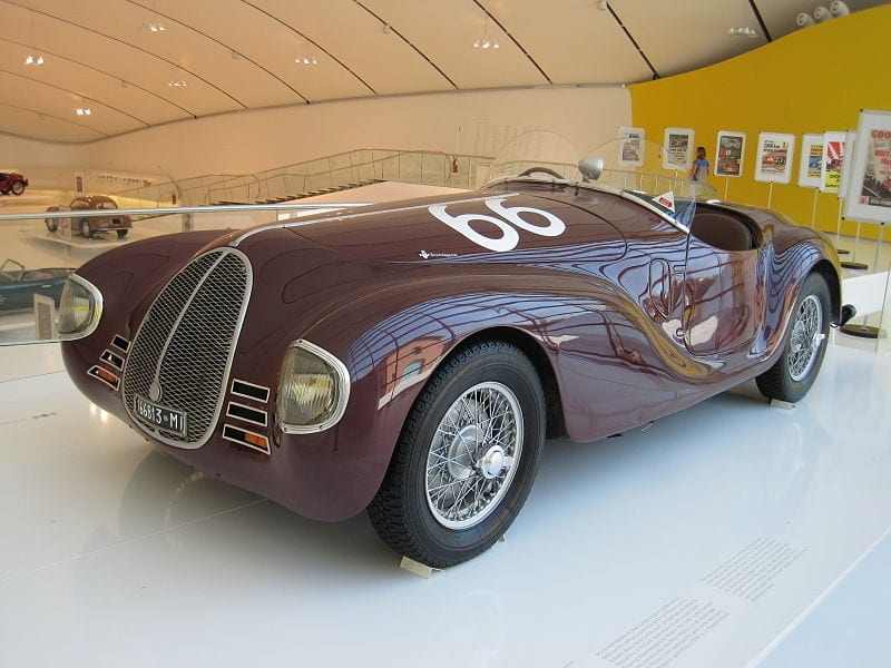 a vintage open top Ferrari