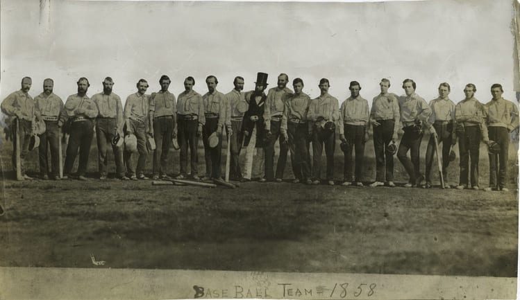vintage picture of baseball players and their umpire