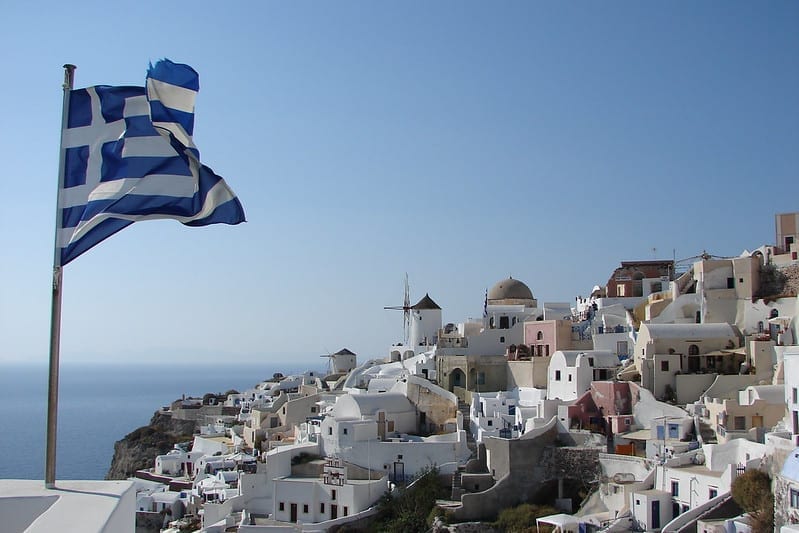 The Greek flag, flying over Santorini