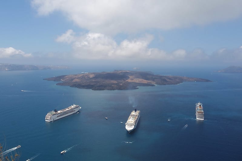 Three large cruise ships anchored off Santorini