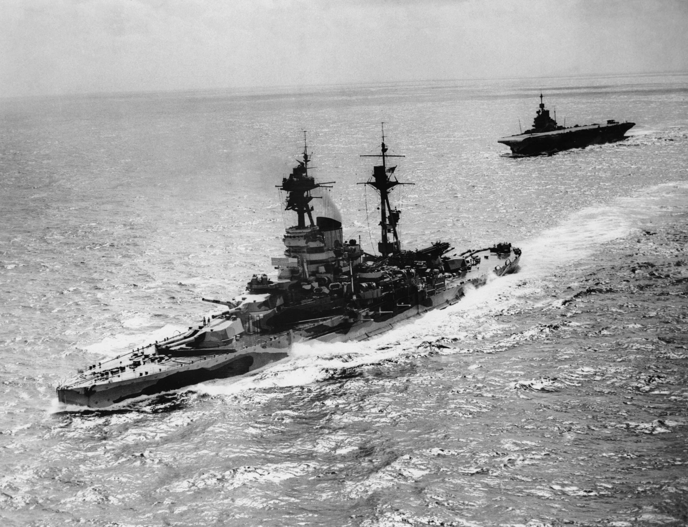 Naval ships in convoy - a destroyer and aircraft carrier