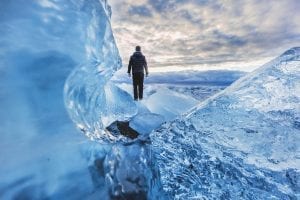 a man standing on top of a glacier - don't try this yourself!