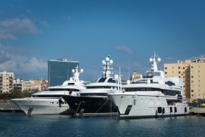 3 superyachts moored together