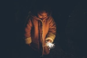 Young girl holding sparkler