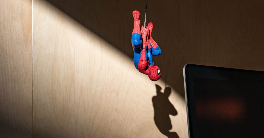 Spiderman hanging upside down