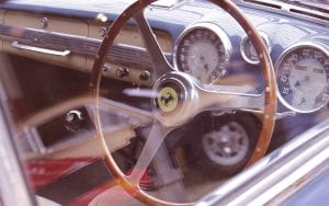 The wooden wheel of a vintage Ferrari