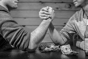 two men, arm wrestling 