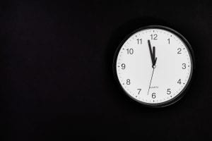 a clock, nearly at midnight