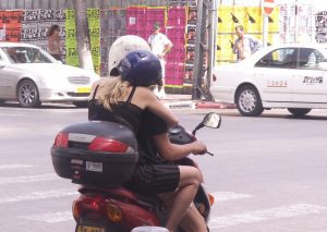 young adults on scooter in Tel Aviv