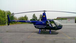 A Robinson R44 Helicopter on a helipad