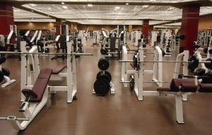 a modern gym with lots of weightlifting machines