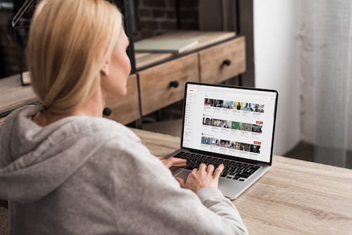 Woman watching Youtube on her computer