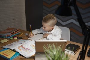 Young child learning from text books