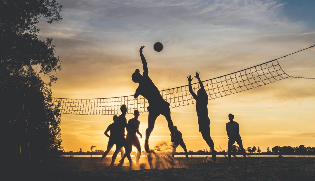 a volleyball match on the beach
