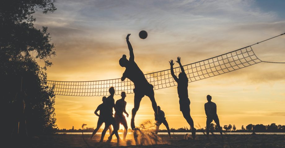 a volleyball match on the beach